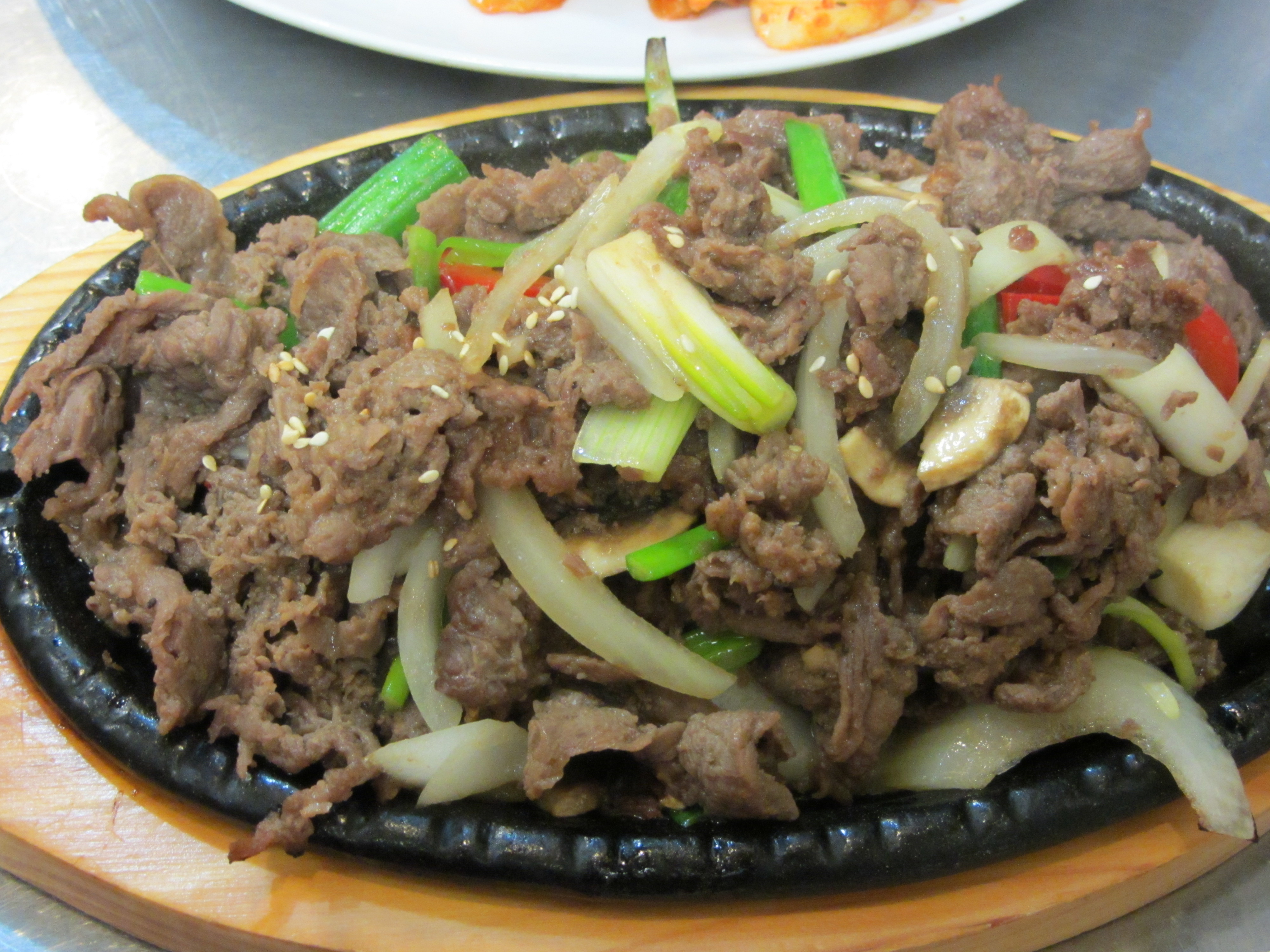 Bulgogi, grilled tender, thinly sliced beef marinated in special sauce